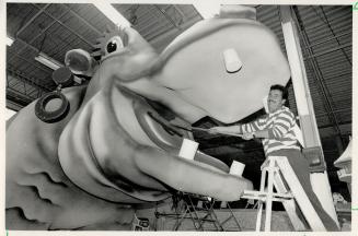 Rosie gets the brush-off, Don Bezanson gives a smiling Rosie the Hippo the salon treatment in the Santa Claus Parade warehouse on Wendell Ave., North York, yesterday