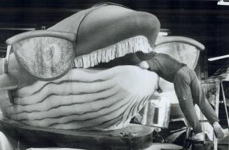 Whale Tale: Dave Lagrotta makes some last-minute adjustments yesterday to a whale's mouth, part of a new Santa Claus parade float