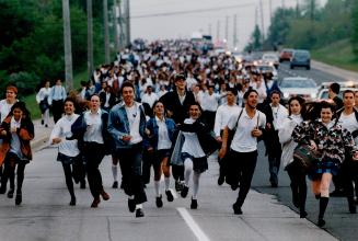 Hundreds of students from two Catholic high schools march to Mississauga City Hall yesterday to protest a work-to-rule campaign by Dufferin-Peel Catho(...)