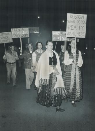 In native costumes, Canadians of East European extraction march in protest near Parliament Buildings where Soviet Premier Alexei Kosygin was at state dinner. [Incomplete]
