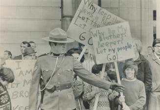 Waiting to protest outside the staid Rideau Club in Ottawa, where visiting Premier Alexei Kosygin today entertained Prime Minister Pierre Trudeau and (...)