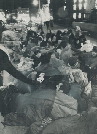 Bundled against the cold, University of Toronto students protesting racial violence in Selma Ala