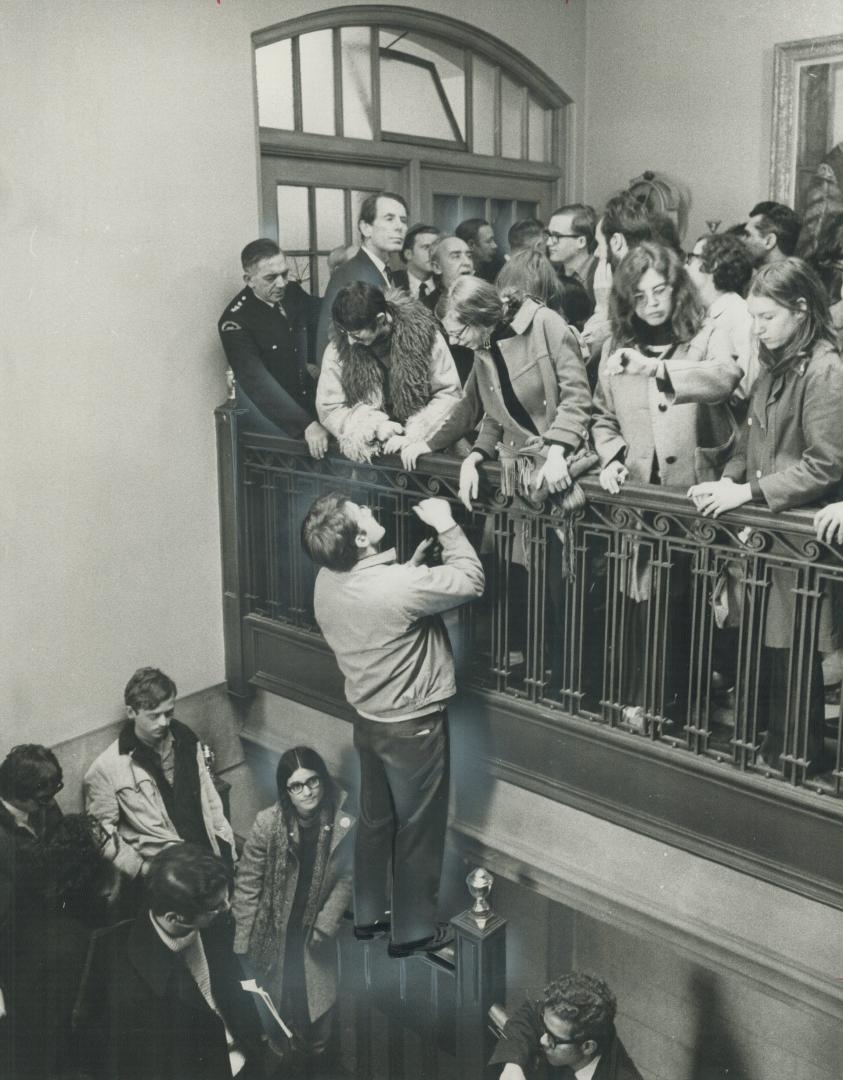 Students jam a balcony leading to the office of University of Toronto president Claude Bissell