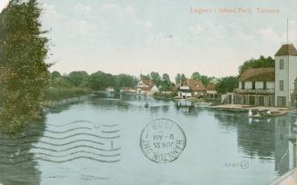 Colourized picture of a lagoon with boathouses. 