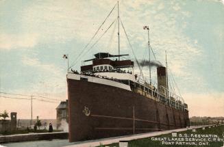 Large steamship at dockside.