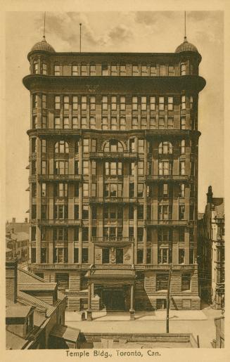 Sepia toned photograph of a large, Victorian office building.