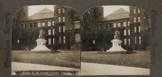 Pictures show a large statue of a seated woman in front of the building.