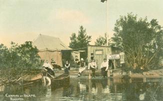 Colorized photograph of eight people siting on a dock in front of a tent.