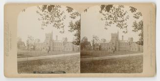 Pictures show a very large three story university building with a central tower.
