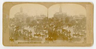 Pictures show a large crowd gathered in grounds surrounding a huge, Victorian hall.