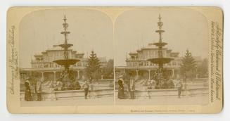 Pictures show people standing around elaborate gardens and a fountain with a Victorian building ...
