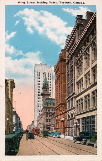 Colorized photograph of cars and a streetcar on a busy downtown street.
