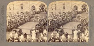 Pictures show soldiers and crowds standing along side a walkway and stairs leading to a doorway ...