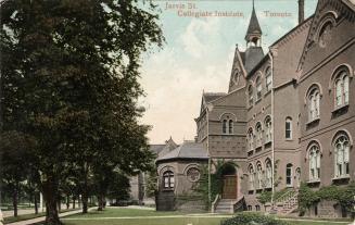 Colorized photograph of a large Gothic school building with a large tree in front of it. Gothic ...