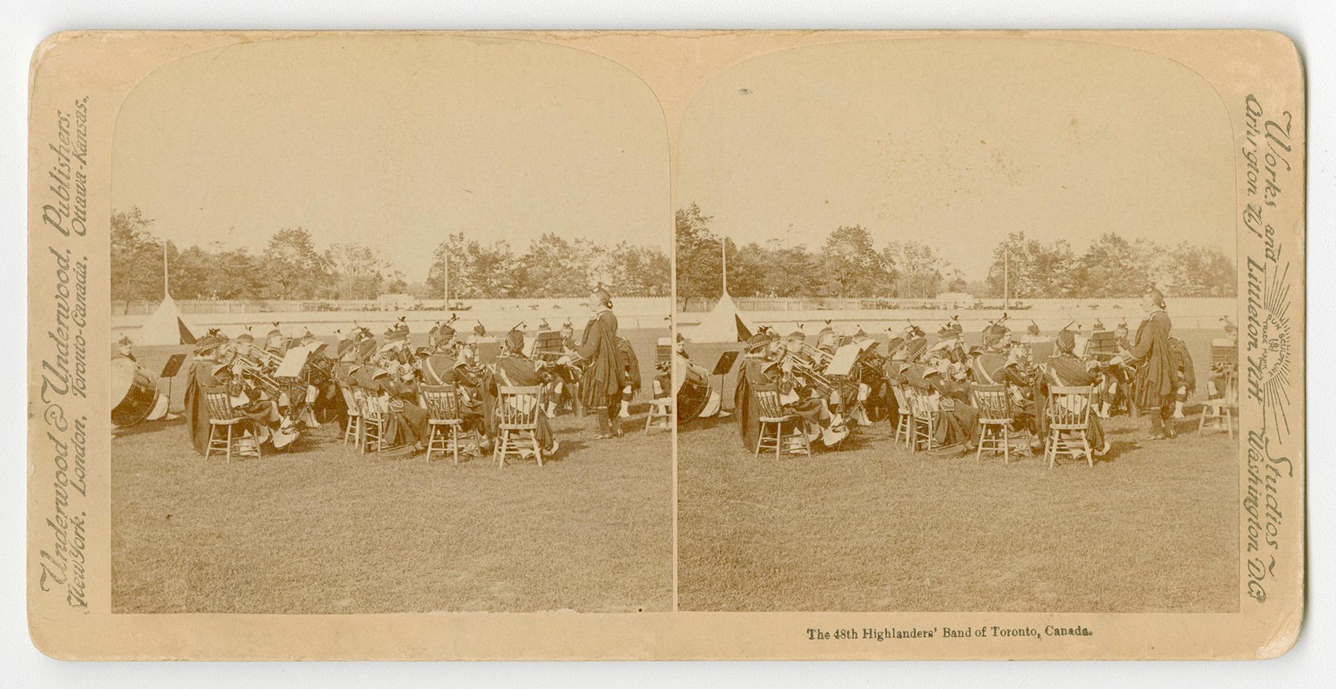 Pictures show members of a pipe and drum band sitting on chairs with their instruments in an ou ...