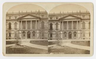 Pictures show the central front entrance of a huge, Palladian style building.