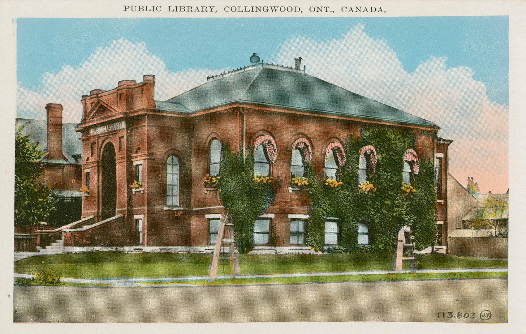 Picture of street corner with ivy covered public library building. 
