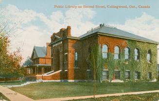 Picture of a street corner with ivy covered public library and house to the left of it with lar ...
