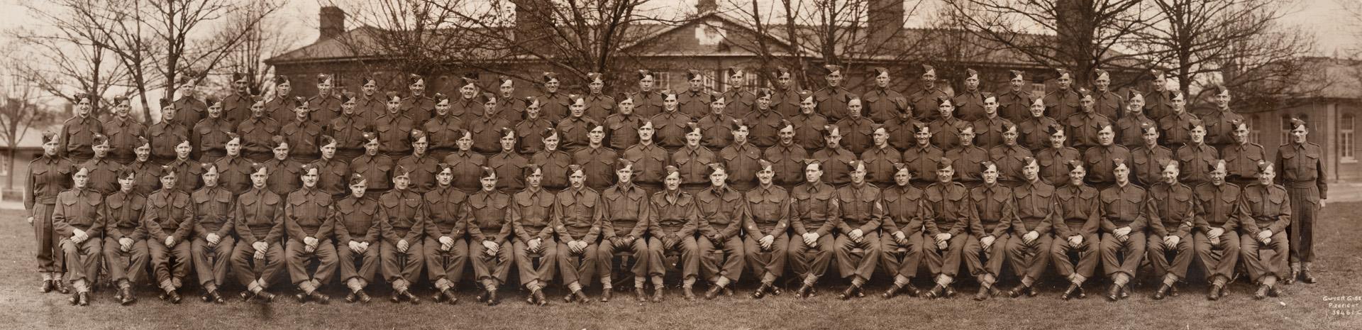 A photograph of a Canadian military regiment with approximately one hundred soldiers, seated an ...