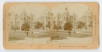 Pictures show two people standing on the lawn in from of a huge Ricardsonian Romanesque buildin ...