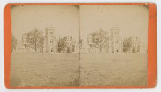 Pictures show a large lawn with a huge collegiate-gothic style building in the background.