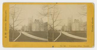 Pictures show a huge collegiate gothic complex in the distance in front of roads and lawns.