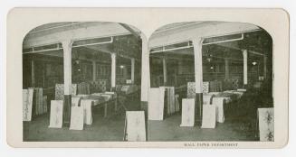 Two photographs of the interior of a room where wallpaper samples in various patterns and shade ...