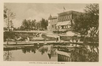 Sepia toned photograph of people in boats on a body of water with buildings of a small town in  ...