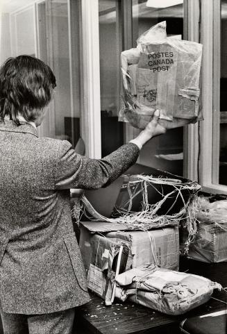 Damaged parcels that had contained books are sometimes wrapped in plastic by the post office