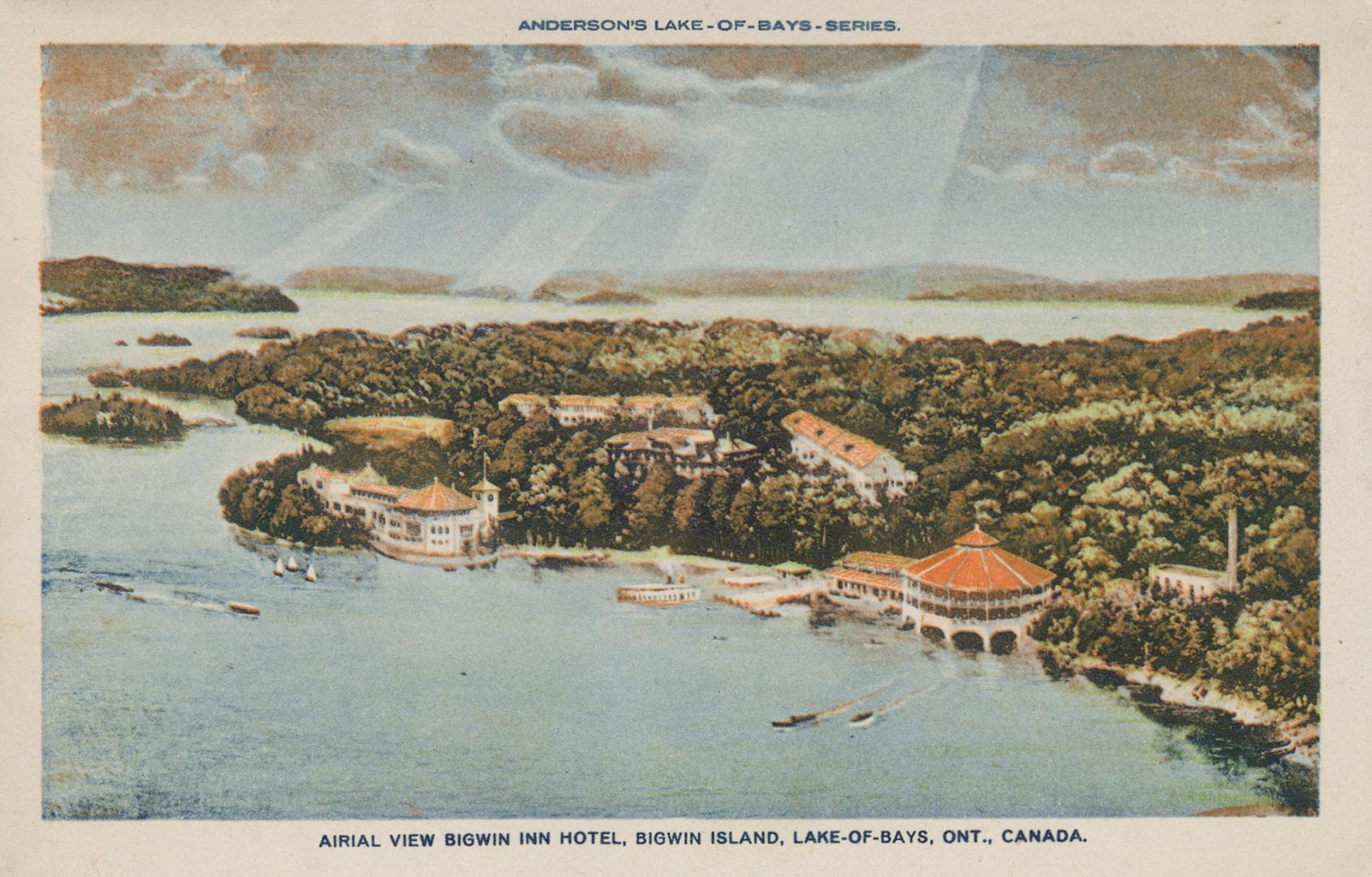 Aerial photograph of resorts on a shoreline of a lake.