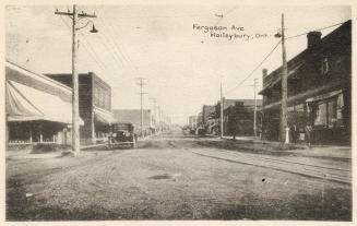 Photograph of an intersection of streets in a small town.