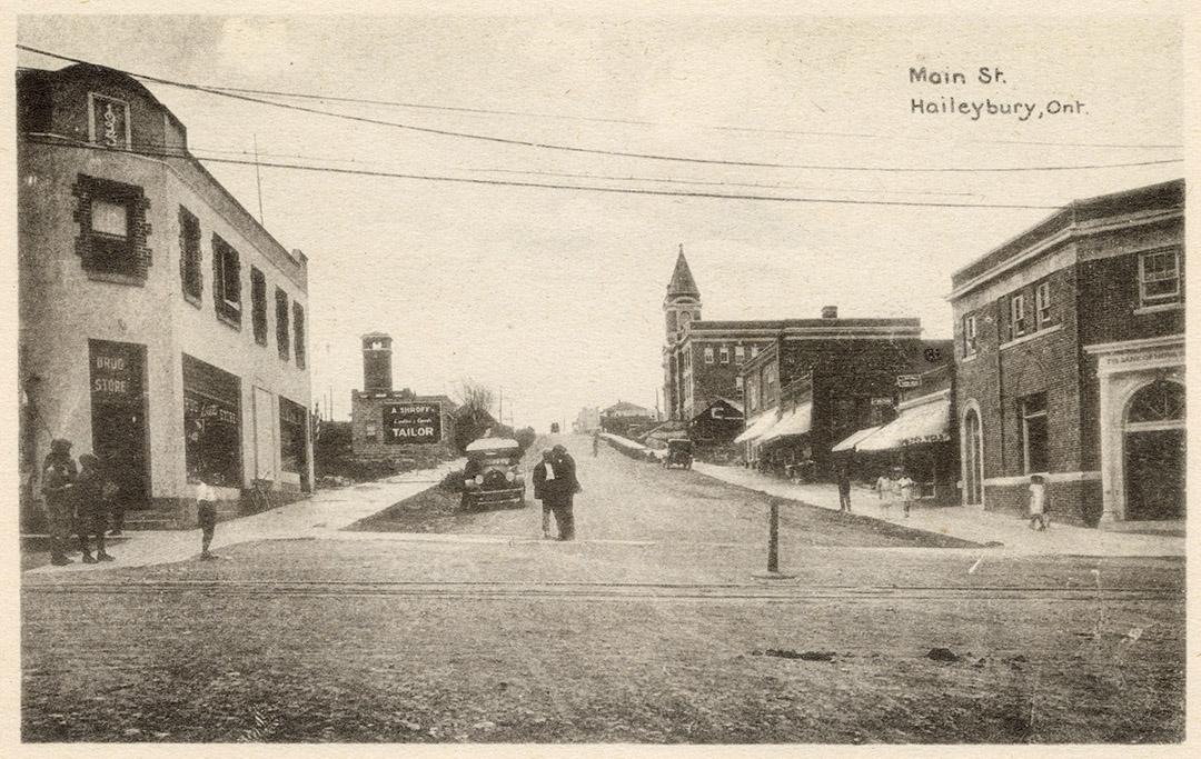 Photograph of an intersection of streets in a small town.