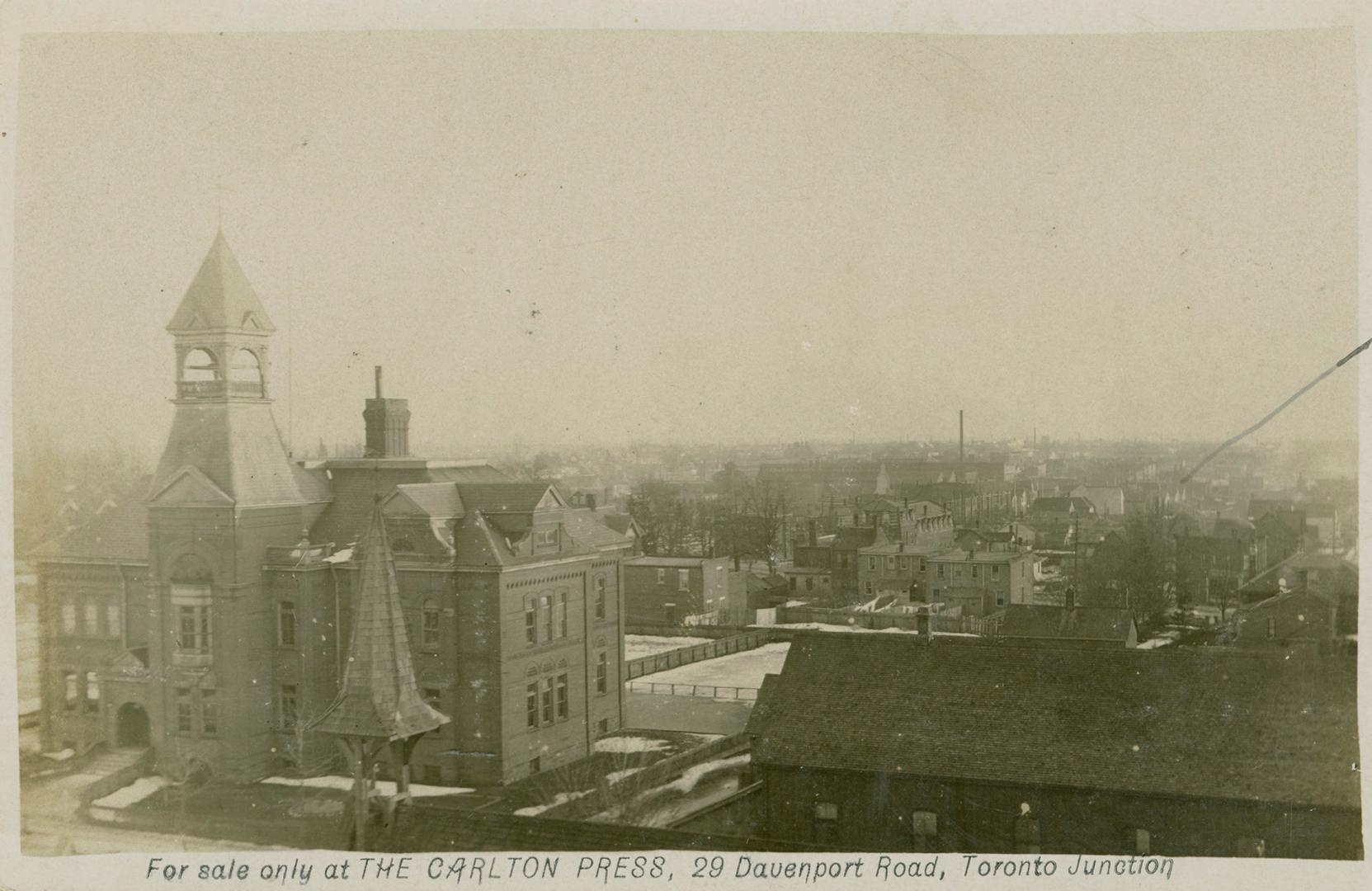 View from a tower of a school and surrounding neighbourhood. 