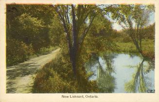 Colorized photograph of a country road beside a river.