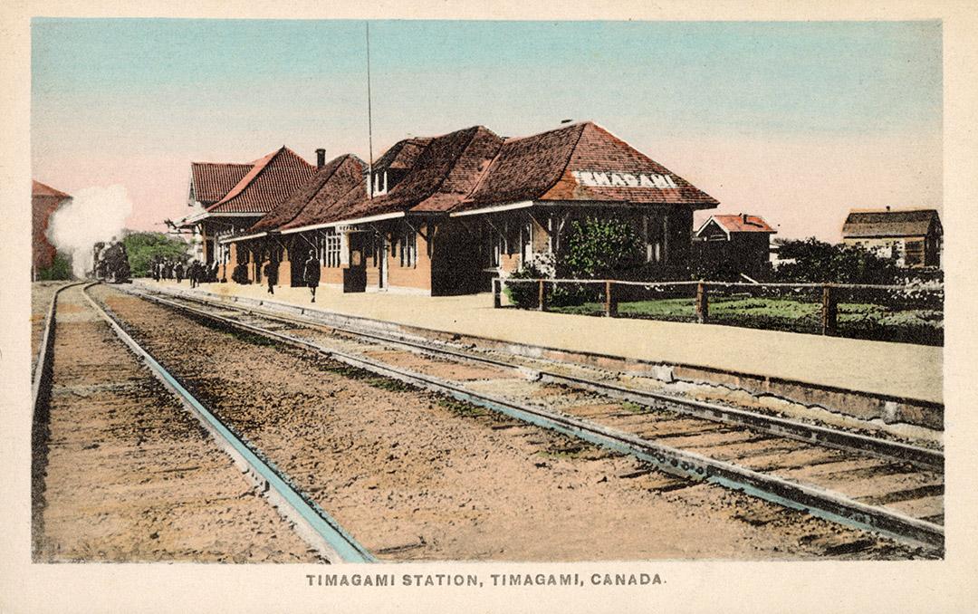 Colorized photograph of a train station in the country.