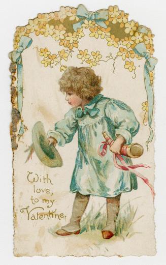 Boy holding hat and horn under flower arch with blue bows. 