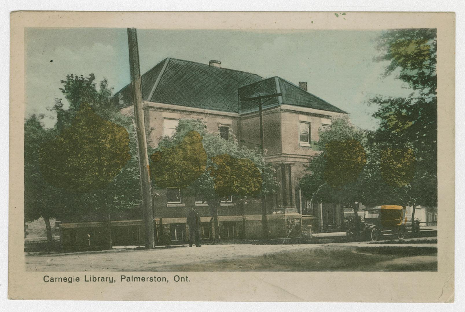 Picture of library building on treed street.