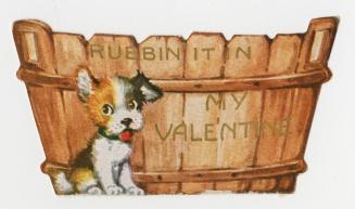 A die-cut card. A puppy stands in front of a wooden barrel.