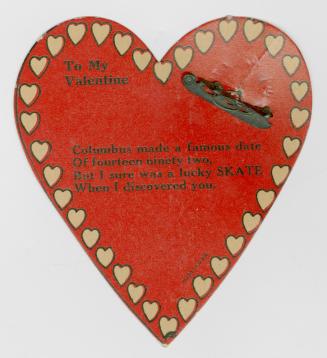 A red heart shaped card with a rhyming verse in the centre. The verse mentions that the sender  ...
