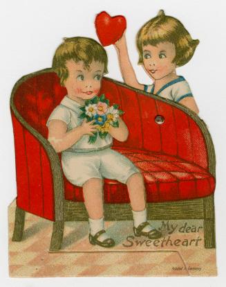 A mechanical card. A boy sits on a red couch holding a bouquet of flowers. On a pivot, behind t ...