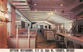 Colour photo postcard depicting the inside of a restaurant with caption at the bottom of the ca ...