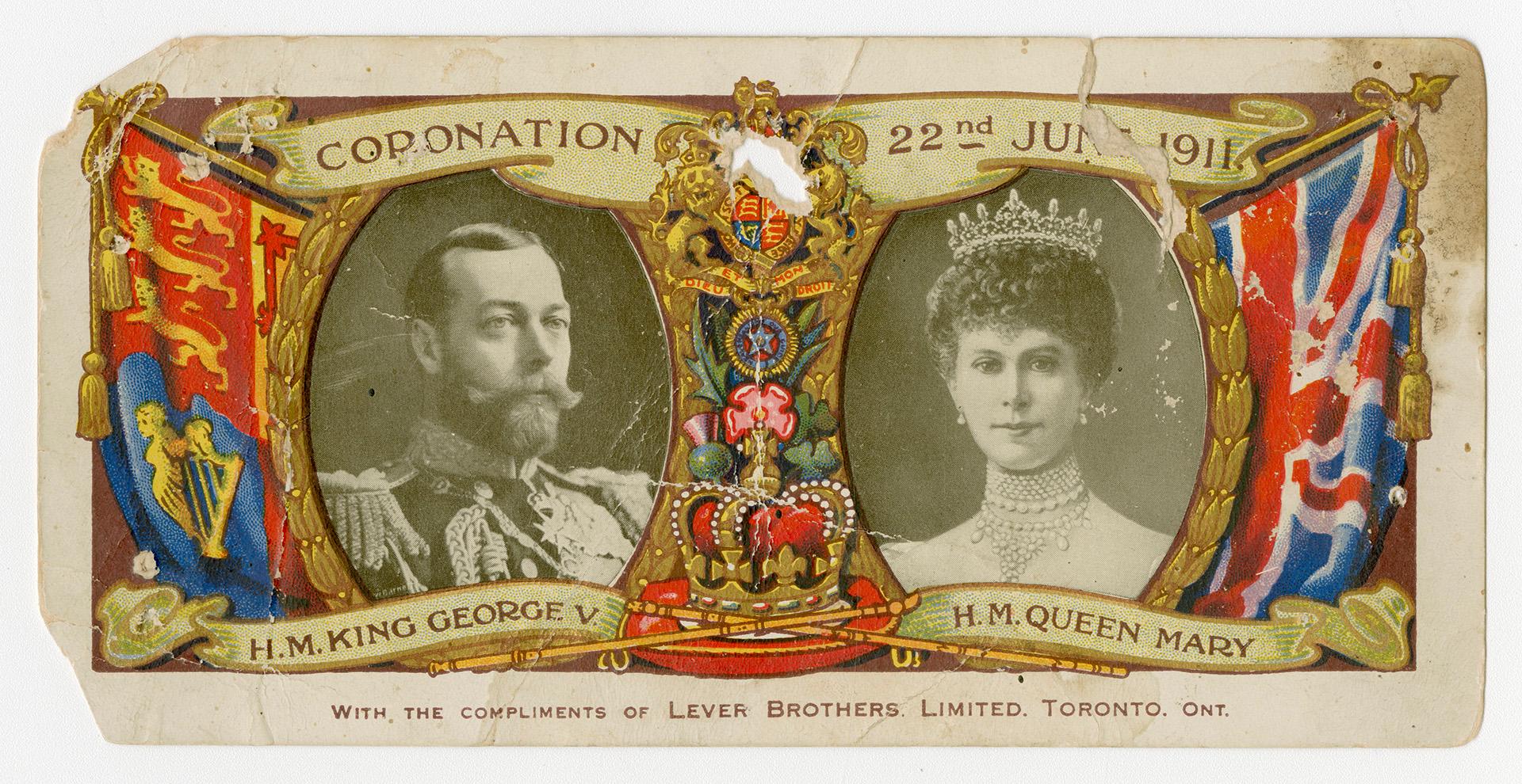 Photo portraits of King George V, and Queen Mary. The Union Jack flag and Royal Standard (outsi ...