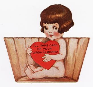 A young girl sits in a barrel holding a large heart in front of her.Made in the U.S.A.