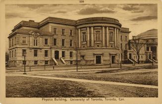 Sepia-toned photo postcard depicting a building with caption at the bottom stating, "Physics Bu ...