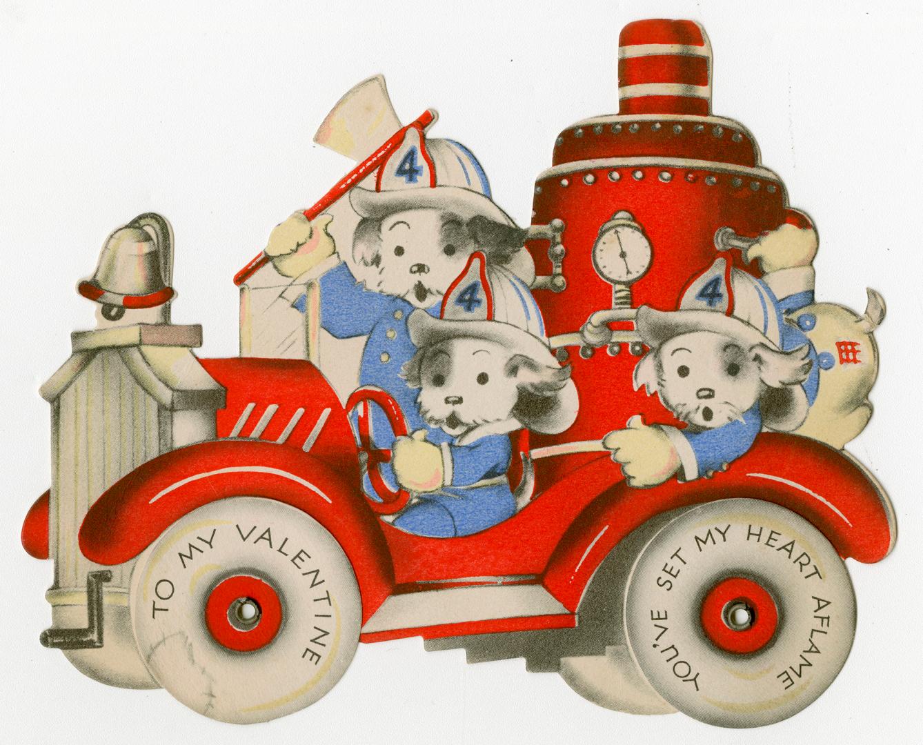 A mechanical card. Dogs wearing uniforms and firefighter's hats drive a big red truck. The whee ...