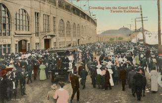 Colorized photograph of a large crowd of people standing in front of a huge Beaux Arts building ...