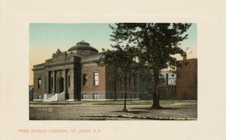 Picture of large brick and stone library building with white border.