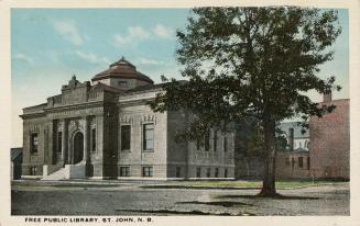 Picture of large brick and stone library building with thin white border.