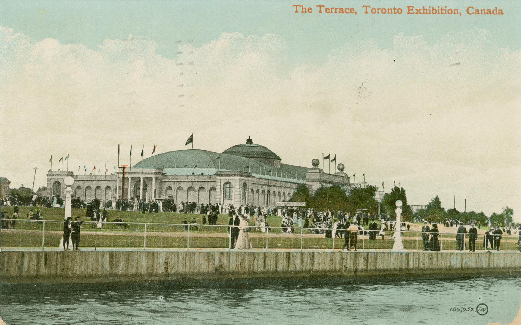 Colorized photograph of a crowd of people standing on a cement embankment looking into a body o ...