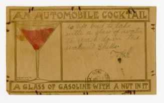 Picture of a martini glass filled with red liquid and a metal nut at the bottom.